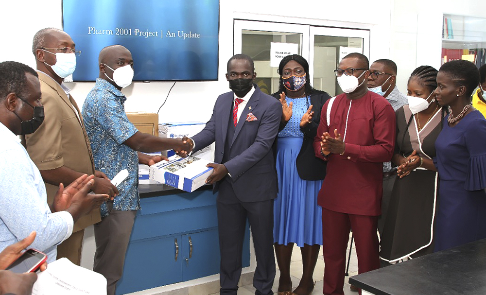 Mr. Ernest Owusu Aboagye (right) Making a Presentation to the Dean of FPPS, Professor Berko Panyin Anto